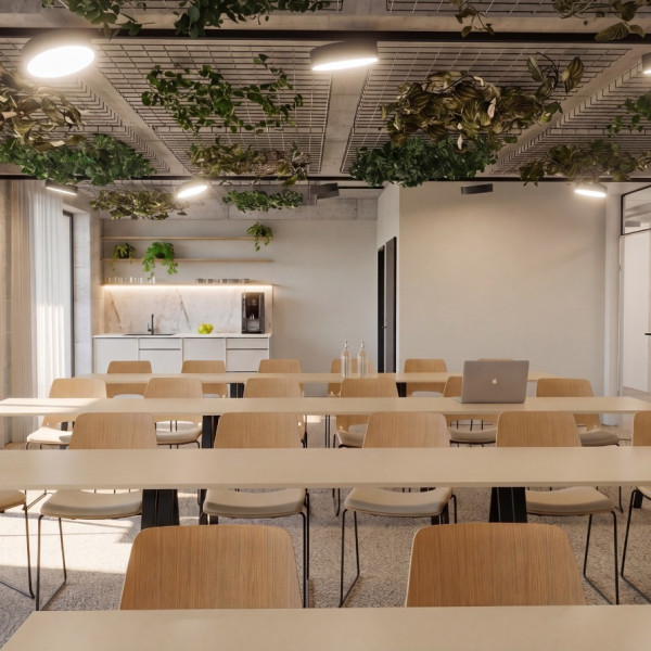 Modernes Open-Space-BÃ¼ro im Greenhouse Senden mit ergonomischen ArbeitsplÃ¤tzen, Sichtbetondecke, Holzboden und schallabsorbierenden Deckenelementen.